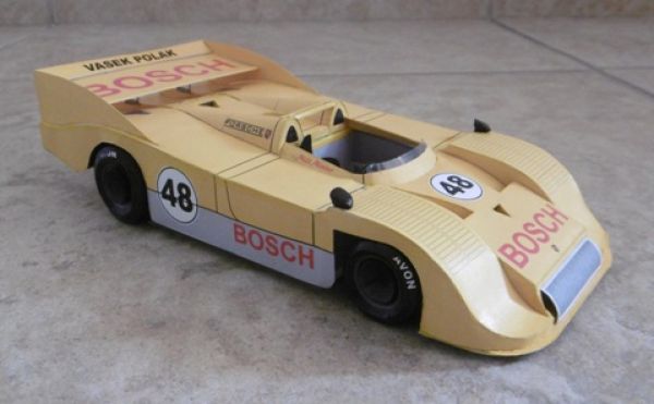 vier Rennwagen Porsche 917/30 in verschiedenen Bemalungsmustern 1:24